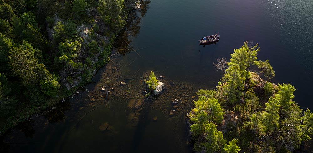 boat by shallow island crossing