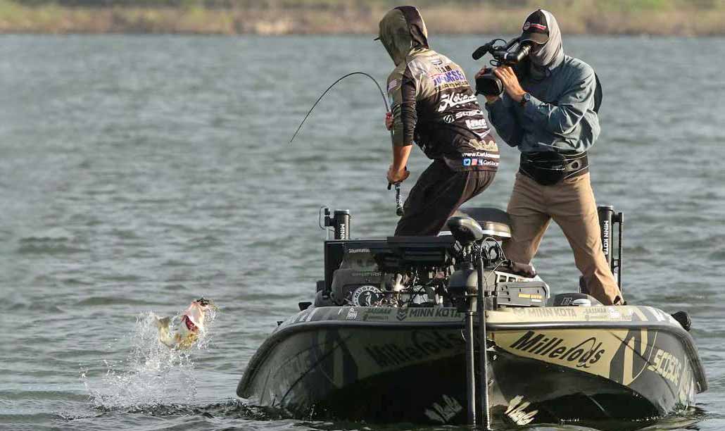 carl jocumsen boat flips fish at lake tenkiller