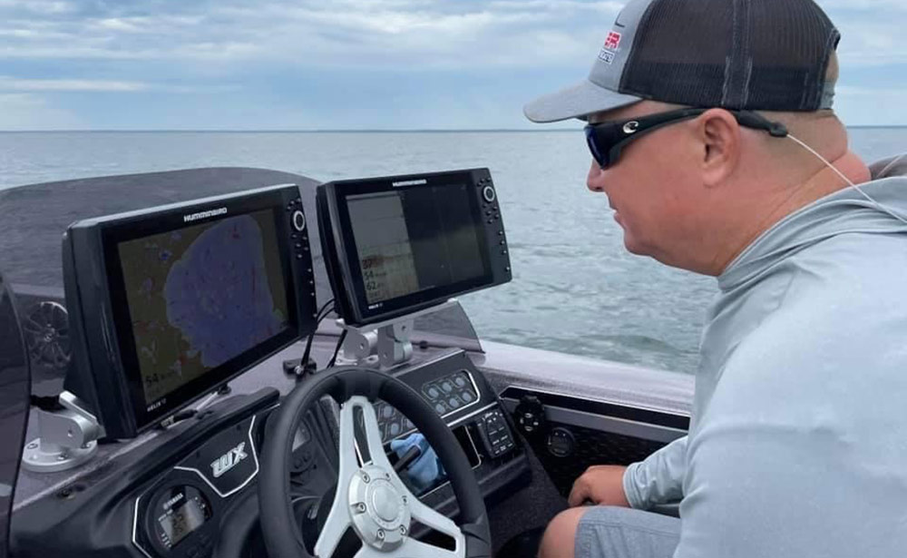 mark courts looking for walleye on his electronics