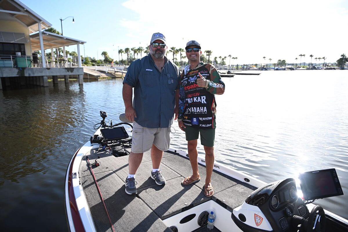 Vetern and youth leader David Lowrie and pro angler Chris Zaldain on the bow of Lowrie's newly outfitted Skeeter bass boat