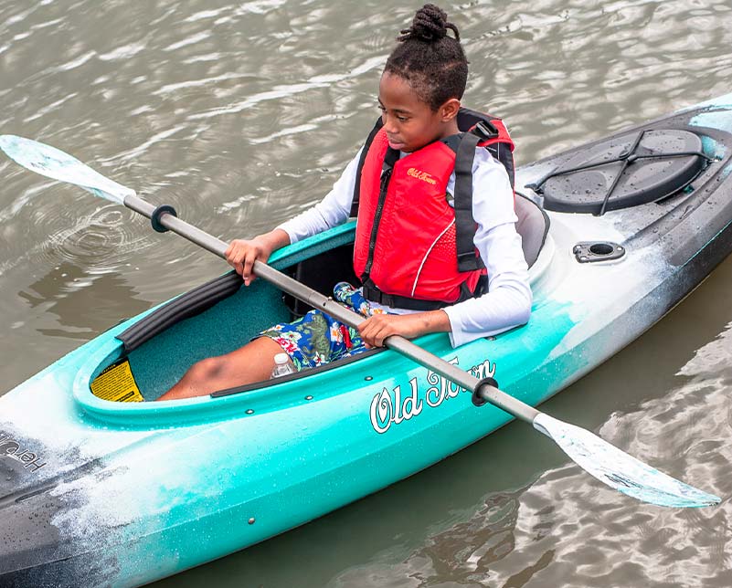 Teen in the Old Town Heron Kayak